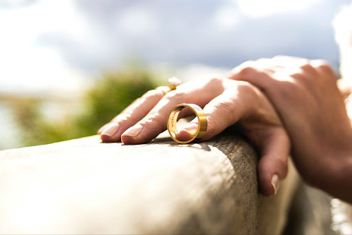 Person holding the ring of their divorced spouse.